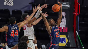 Jan 13, 2021; Athens, Georgia, USA; Auburn basketball forward Jaylin Williams (23) reaches for a rebound against Georgia Bulldogs forward Toumani Camara (10) during the second half at Stegeman Coliseum. Mandatory Credit: Dale Zanine-USA TODAY Sports