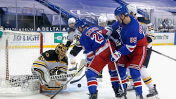NEW YORK, NEW YORK - FEBRUARY 10: Tuukka Rask #40 of the Boston Bruins makes the save on Chris Kreider #20 of the New York Rangers at Madison Square Garden on February 10, 2021 in New York City. The Bruins defeated the Rangers 3-2 in overtime. (Photo by Bruce Bennett/Getty Images)
