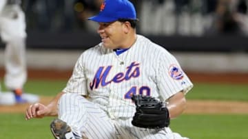 Apr 19, 2014; New York, NY, USA; New York Mets starting pitcher Bartolo Colon (40) reacts after avoiding a single hit by Atlanta Braves right fielder Jason Heyward (not pictured) during the fifth inning at Citi Field. Mandatory Credit: Adam Hunger-USA TODAY Sports