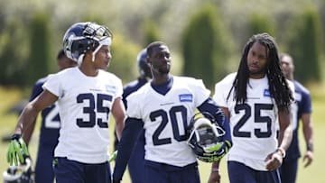 Jun 15, 2016; Seattle, WA, USA; Seattle Seahawks cornerback DeShawn Shead (35), cornerback Jeremy Lane (20), and cornerback Richard Sherman (25) walk back to the locker room following a minicamp practice at the Virginia Mason Athletic Center. Mandatory Credit: Joe Nicholson-USA TODAY Sports