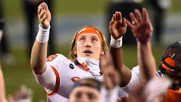 Dec 19, 2020; Charlotte, NC, USA; Clemson Tigers quarterback Trevor Lawrence (16) celebrates with teammates after winning the ACC Football Championship at Bank of America Stadium. Mandatory Credit: Bob Donnan-USA TODAY Sports