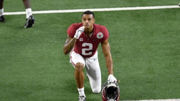 ARLINGTON, TEXAS - JANUARY 01: Patrick Surtain II #2 of the Alabama Crimson Tide kneels before the College Football Playoff Semifinal at the Rose Bowl football game against the Notre Dame Fighting Irish at AT&T Stadium on January 01, 2021 in Arlington, Texas. The Alabama Crimson Tide defeated the Notre Dame Fighting Irish 31-14. (Photo by Alika Jenner/Getty Images)