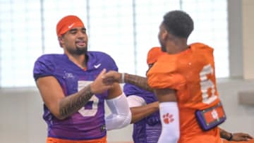 Clemson quarterback D.J. Uiagalelei(5) greets wide receiver E.J. Williams(6) before warmups at football practice in Clemson, S.C. Monday, March 22, 2021.Clemson Spring Football Practice