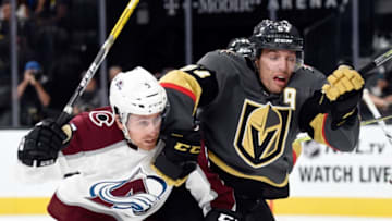 LAS VEGAS, NV - SEPTEMBER 28: David Warsofsky #5 of the Colorado Avalanche and David Perron #57 of the Vegas Golden Knights chase after the puck during a preseason game at T-Mobile Arena on September 28, 2017 in Las Vegas, Nevada. Colorado won 4-2. (Photo by David Becker/NHLI via Getty Images)