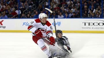 Mar 5, 2016; Tampa, FL, USA; Carolina Hurricanes left wing Jeff Skinner (53) skates with the puck as Tampa Bay Lightning defenseman Matt Carle (25) defends during the first period at Amalie Arena. Mandatory Credit: Kim Klement-USA TODAY Sports
