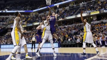 Jan 30, 2014; Indianapolis, IN, USA; Phoenix Suns guard Goran Dragic (1) takes a shot against Indiana Pacers center Roy Hibbert (55) at Bankers Life Fieldhouse. Mandatory Credit: Brian Spurlock-USA TODAY Sports