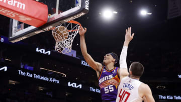 PHOENIX, ARIZONA - APRIL 09: Darius Bazley #55 of the Phoenix Suns dunks over Ivica Zubac #40 of the Los Angeles Clippers during the first half of the game at Footprint Center on April 09, 2023 in Phoenix, Arizona. NOTE TO USER: User expressly acknowledges and agrees that, by downloading and or using this photograph, User is consenting to the terms and conditions of the Getty Images License Agreement. (Photo by Chris Coduto/Getty Images)