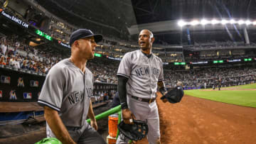 MIAMI, FL - AUGUST 22: Brett Gardner #11 and Aaron Hicks #31 of the New York Yankees take the field against the Miami Marlins at Marlins Park on August 22, 2018 in Miami, Florida. (Photo by Mark Brown/Getty Images)