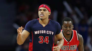 Mar 6, 2016; Auburn Hills, MI, USA; Detroit Pistons forward Tobias Harris (34) celebrates after a three point shot in the fourth quarter as Portland Trail Blazers forward Al-Farouq Aminu (8) follows at The Palace of Auburn Hills. The Pistons defeated the 123-103. Mandatory Credit: Leon Halip-USA TODAY Sports