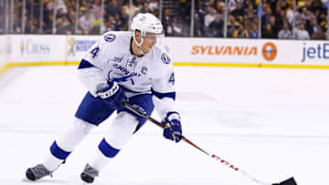 BOSTON, MA - APRIL 25: Vincent Lecavalier #4 of the Tampa Bay Lightning skates the puck against the Boston Bruins during the game on April 25, 2013 at TD Garden in Boston, Massachusetts. (Photo by Jared Wickerham/Getty Images)