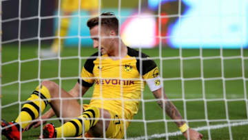 Dortmund's German forward Marco Reus sits on the pitch during the German first division Bundesliga football match Hannover 96 vs Borussia Dortmund in Hanover, northern Germany, on August 31, 2018. (Photo by Ronny Hartmann / AFP) / RESTRICTIONS: DFL REGULATIONS PROHIBIT ANY USE OF PHOTOGRAPHS AS IMAGE SEQUENCES AND/OR QUASI-VIDEO (Photo credit should read RONNY HARTMANN/AFP/Getty Images)