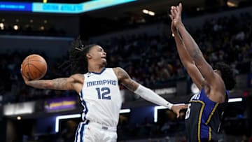 INDIANAPOLIS, INDIANA - JANUARY 14: Ja Morant #12 of the Memphis Grizzlies dunks the ball over Jalen Smith #25 of the Indiana Pacers in the third quarter at Gainbridge Fieldhouse on January 14, 2023 in Indianapolis, Indiana. NOTE TO USER: User expressly acknowledges and agrees that, by downloading and or using this photograph, User is consenting to the terms and conditions of the Getty Images License Agreement. (Photo by Dylan Buell/Getty Images)