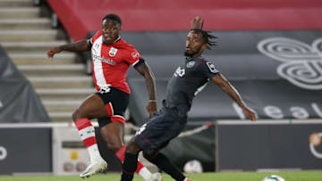 SOUTHAMPTON, ENGLAND - SEPTEMBER 16: Michael Obafemi of Southampton and Tariqe Fosu of Brentford compete for the ball during the Carabao Cup Second Round match between Southampton FC and Brentford FC at St. Mary's Stadium on September 16, 2020 in Southampton, England. (Photo by Robin Jones/Getty Images)