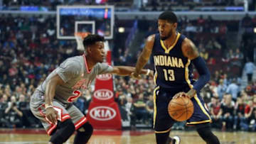 Nov 16, 2015; Chicago, IL, USA; Indiana Pacers forward Paul George (13) drives against Chicago Bulls guard Jimmy Butler (21) during the first half at United Center. Mandatory Credit: Kamil Krzaczynski-USA TODAY Sports