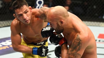 WINNIPEG, CANADA - DECEMBER 16: (L-R) Rafael Dos Anjos of Brazil punches Robbie Lawler in their welterweight bout during the UFC Fight Night event at Bell MTS Place on December 16, 2017 in Winnipeg, Manitoba, Canada. (Photo by Josh Hedges/Zuffa LLC/Zuffa LLC via Getty Images)