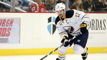 Mar 29, 2016; Pittsburgh, PA, USA; Buffalo Sabres right wing Brian Gionta (12) carries the puck against the Pittsburgh Penguins during the first period at the CONSOL Energy Center. Mandatory Credit: Charles LeClaire-USA TODAY Sports