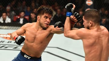 DETROIT, MI - DECEMBER 02: (L-R) Henry Cejudo punches Sergio Pettis in their flyweight bout during the UFC 218 event inside Little Caesars Arena on December 02, 2017 in Detroit, Michigan. (Photo by Josh Hedges/Zuffa LLC/Zuffa LLC via Getty Images)
