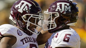 Oct 16, 2021; Columbia, Missouri, USA; Texas A&M Aggies running back Devon Achane (6) celebrates with wide receiver Ainias Smith (0) after scoring a touchdown against the Missouri Tigers during the second half at Faurot Field at Memorial Stadium. Mandatory Credit: Jay Biggerstaff-USA TODAY Sports