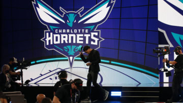 Jul 29, 2021; Brooklyn, New York, USA; James Bouknight (Connecticut) walks off the stage after being selected as the number eleven overall pick by the Charlotte Hornets in the first round of the 2021 NBA Draft at Barclays Center. Mandatory Credit: Brad Penner-USA TODAY Sports