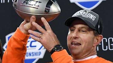 Clemson Head Coach Dabo Swinney celebrates with the ACC football championship trophy after the ACC Championship game in Charlotte, N.C. Saturday, December 7, 2019.2019 Acc Football Championship Clemson Vs Virginia
