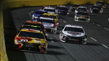 CHARLOTTE, NC - MAY 19: Kyle Busch, driver of the #18 M&M's Red Nose Day Toyota, leads a pack of cars during the Monster Energy NASCAR Cup Series All-Star Race at Charlotte Motor Speedway on May 19, 2018 in Charlotte, North Carolina. (Photo by Streeter Lecka/Getty Images)