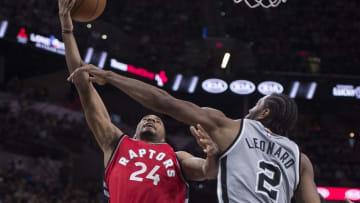 Apr 2, 2016; San Antonio, TX, USA; San Antonio Spurs forward Kawhi Leonard (2) defends against Toronto Raptors guard Norman Powell (24) during the second half at the AT&T Center. The Spurs defeat the Raptors 102-95. Mandatory Credit: Jerome Miron-USA TODAY Sports