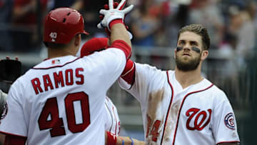 Jul 3, 2016; Washington, DC, USA; Washington Nationals right fielder Bryce Harper (34) is congratulated by catcher Wilson Ramos (40) after hitting a solo home run against the Cincinnati Reds during the fifth inning at Nationals Park. Mandatory Credit: Brad Mills-USA TODAY Sports