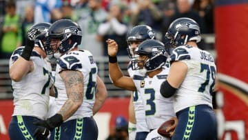 SANTA CLARA, CA - NOVEMBER 26: Russell Wilson #3 of the Seattle Seahawks celebrates with teammates after scoring a touchdown against the San Francisco 49ers at Levi's Stadium on November 26, 2017 in Santa Clara, California. (Photo by Lachlan Cunningham/Getty Images)