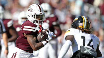 STARKVILLE, MISSISSIPPI - NOVEMBER 18: Jo'Quavious Marks #7 of the Mississippi State Bulldogs carries the ball against Zay Franks #14 of the Southern Miss Golden Eagles during the second half at Davis Wade Stadium on November 18, 2023 in Starkville, Mississippi. (Photo by Justin Ford/Getty Images)