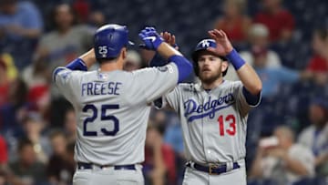 PHILADELPHIA, PA - JULY 17: David Freese #25 of the Los Angeles Dodgers is greeted at home plate by Max Muncy #13 after hitting a two-run home run in the seventh inning during a game against the Philadelphia Phillies at Citizens Bank Park on July 17, 2019 in Philadelphia, Pennsylvania. (Photo by Hunter Martin/Getty Images)