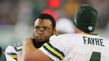 PHILADELPHIA - DECEMBER 5: Ahman Green #30 and Brett Favre #4 of the Green Bay Packers embrace on the sideline during the game against the Philadelphia Eagles at Lincoln Financial Field on December 5, 2004 in Philadelphia, Pennsylvania. The Eagles defeated the Packers 47-17. (Photo by Ezra Shaw/Getty Images)