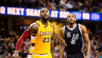 CLEVELAND, OH - JANUARY 30: LeBron James #23 of the Cleveland Cavaliers and Kawhi Leonard #2 of the San Antonio Spurs wait for a rebound during the second half at Quicken Loans Arena on January 30, 2016 in Cleveland, Ohio. The Cavaliers defeated the Spurs 117-103. NOTE TO USER: User expressly acknowledges and agrees that, by downloading and/or using this photograph, user is consenting to the terms and conditions of the Getty Images License Agreement. Mandatory copyright notice. (Photo by Jason Miller/Getty Images)