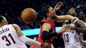 Nov 10, 2014; Cleveland, OH, USA; New Orleans Pelicans guard Austin Rivers (25) drives to the basket as Cleveland Cavaliers forward Shawn Marion (31) and Cleveland Cavaliers forward Tristan Thompson (13) defend during the fourth quarter at Quicken Loans Arena. The Cavaliers beat the Pelicans 118-111. Mandatory Credit: Ken Blaze-USA TODAY Sports