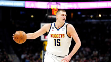 Feb 7, 2023; Denver, Colorado, USA; Denver Nuggets center Nikola Jokic (15) controls the ball in the first quarter against the Minnesota Timberwolves at Ball Arena. Mandatory Credit: Ron Chenoy-USA TODAY Sports