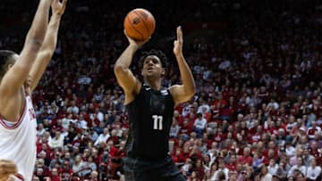 Jan 22, 2023; Bloomington, Indiana, USA; Michigan State Spartans guard A.J. Hoggard (11) shoots the ball while Indiana Hoosiers forward Malik Reneau (5) defends in the second half at Simon Skjodt Assembly Hall. Mandatory Credit: Trevor Ruszkowski-USA TODAY Sports