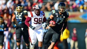 Dec 31, 2013; El Paso, TX, USA; UCLA Bruins quarterback Brett Hundley (17) runs the ball during the first quarter against the Virginia Tech Hokies in the 2013 Sun Bowl at Sun Bowl Stadium. Mandatory Credit: Andrew Weber-USA TODAY Sports