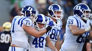 SOUTH BEND, IN - SEPTEMBER 24: AJ Reed #48 of the Duke Blue Devils is congratulated by teammates after kicking the game winning field goal against the Notre Dame Fighting Irish at Notre Dame Stadium on September 24, 2016 in South Bend, Indiana. (Photo by Stacy Revere/Getty Images)