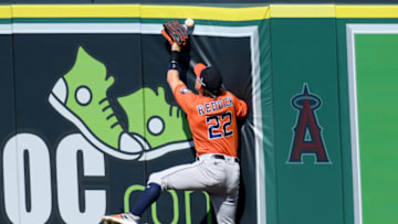 ANAHEIM, CALIFORNIA - SEPTEMBER 06: Josh Reddick #22 of the Houston Astros misses a catch on a triple from Taylor Ward #3 of the Los Angeles Angels during the sixth inning at Angel Stadium of Anaheim on September 06, 2020 in Anaheim, California. (Photo by Harry How/Getty Images)