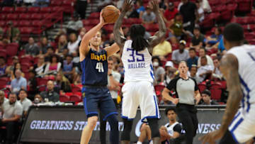 Denver Nuggets forward Jack White (41) looks to pass as Los Angeles Clippers guard Keaton Wallace (35) defends during an NBA Summer League game at Thomas & Mack Center on 13 Jul. 2022. (Stephen R. Sylvanie-USA TODAY Sports)