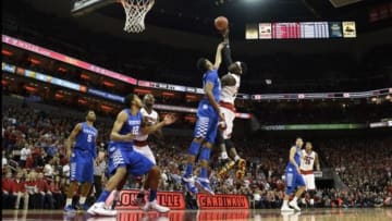 Dec 27, 2014; Louisville, KY, USA; Louisville Cardinals forward Montrezl Harrell (24) shoots against Kentucky Wildcats forward Marcus Lee (00) during the second half at KFC Yum! Center. Kentucky defeated Louisville 58-50. Mandatory Credit: Jamie Rhodes-USA TODAY Sports