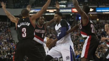 Dec 27, 2015; Sacramento, CA, USA; Portland Trail Blazers guard C.J. McCollum (3) and forward Al-Farouq Aminu (8) and forward Noah Vonleh (21) defend against Sacramento Kings forward Rudy Gay (8) during the third quarter at Sleep Train Arena. The Portland Trail Blazers defeated the Sacramento Kings 98-94. Mandatory Credit: Ed Szczepanski-USA TODAY Sports