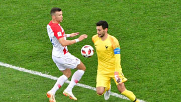 France's goalkeeper Hugo Lloris (R) gets to the ball ahead of Croatia's forward Ivan Perisic during the Russia 2018 World Cup final football match between France and Croatia at the Luzhniki Stadium in Moscow on July 15, 2018. (Photo by Mladen ANTONOV / AFP) / RESTRICTED TO EDITORIAL USE - NO MOBILE PUSH ALERTS/DOWNLOADS (Photo credit should read MLADEN ANTONOV/AFP/Getty Images)
