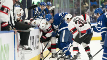 Sep 24, 2022; Toronto, Ontario, CAN; Toronto Maple Leafs right wing Joey Anderson (28) battles for the puck along the boards with Ottawa Senators left wing Matthew Wedman (53) during the second period at Scotiabank Arena. Mandatory Credit: Nick Turchiaro-USA TODAY Sports