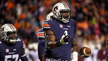 Nov 19, 2016; Auburn, AL, USA; Auburn Tigers defensive tackle Montravius Adams (1) celebrates after picking up a deflected Alabama A&M Bulldogs pass during the first quarter at Jordan Hare Stadium. Mandatory Credit: Shanna Lockwood-USA TODAY Sports