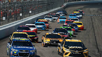 LOUDON, NH - JULY 16: Jimmie Johnson, driver of the #48 Lowe's Chevrolet, and Martin Truex Jr., driver of the #78 WIX Filters Toyota, lead the field into turn one during the Monster Energy NASCAR Cup Series Overton's 301 at New Hampshire Motor Speedway on July 16, 2017 in Loudon, New Hampshire. (Photo by Chris Trotman/Getty Images)