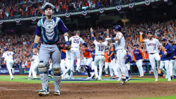 HOUSTON, TEXAS - OCTOBER 11: Cal Raleigh #29 of the Seattle Mariners reacts after a walk-off home run was hit by Yordan Alvarez #44 (not pictured) of the Houston Astros during the ninth inning in game one of the American League Division Series at Minute Maid Park on October 11, 2022 in Houston, Texas. (Photo by Carmen Mandato/Getty Images)