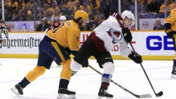 NASHVILLE, TN - NOVEMBER 27: Nashville Predators left wing Filip Forsberg (9) steals the puck from Colorado Avalanche right wing Matt Calvert (11) during the NHL game between the Nashville Predators and Colorado Avalanche, held on November 27, 2018, at Bridgestone Arena in Nashville, Tennessee. (Photo by Danny Murphy/Icon Sportswire via Getty Images)