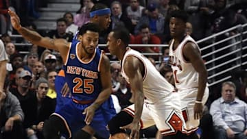 Nov 4, 2016; Chicago, IL, USA; New York Knicks guard Derrick Rose (25) defends Chicago Bulls guard Rajon Rondo (9) during the first quarter at the United Center. Mandatory Credit: David Banks-USA TODAY Sports