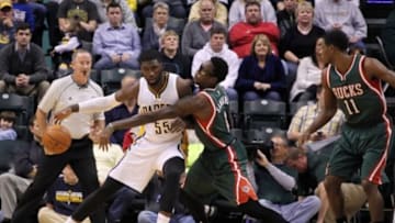 Nov 4, 2014; Indianapolis, IN, USA; Indiana Pacers center Roy Hibbert (55) posts up against Milwaukee Bucks center Larry Sanders (8) at Bankers Life Fieldhouse. Mandatory Credit: Brian Spurlock-USA TODAY Sports