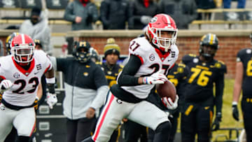 Dec 12, 2020; Columbia, Missouri, USA; Georgia Bulldogs defensive back Eric Stokes (27) returns an interception against the Missouri Tigers during the first half at Faurot Field at Memorial Stadium. Mandatory Credit: Jay Biggerstaff-USA TODAY Sports